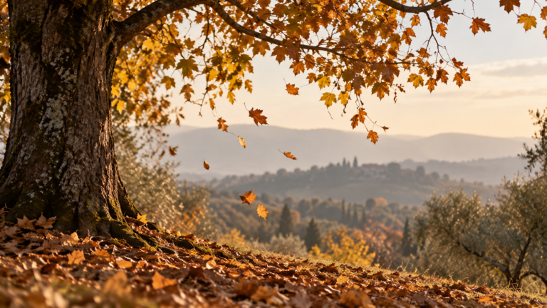 Albero in autunno con foglie dorate che cadono lentamente, simbolo del lasciare andare nello yoga.